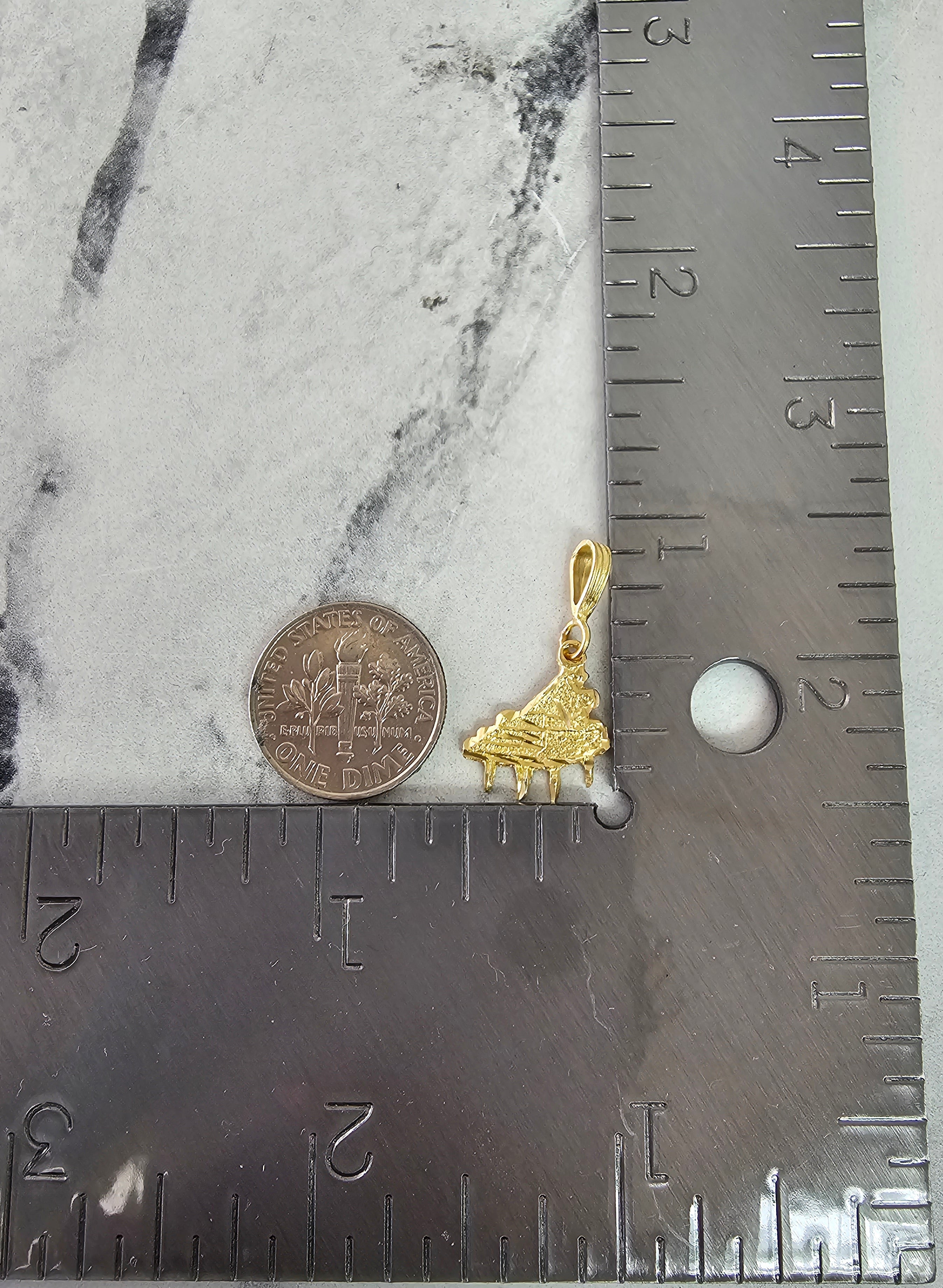 Piano con cortes de diamantes en oro amarillo de 14 k