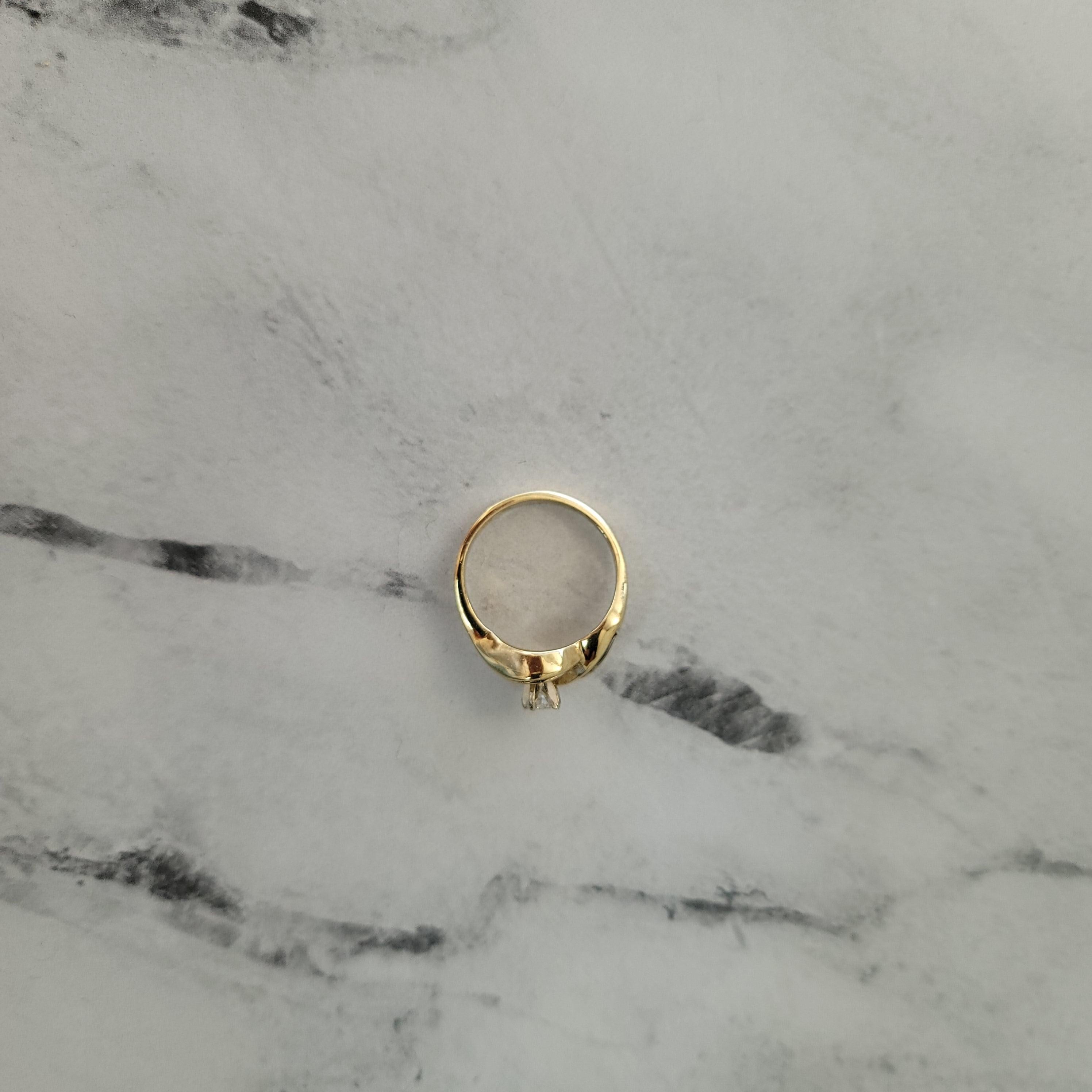 Round Diamond Center with Baguette Accented Engagement Ring