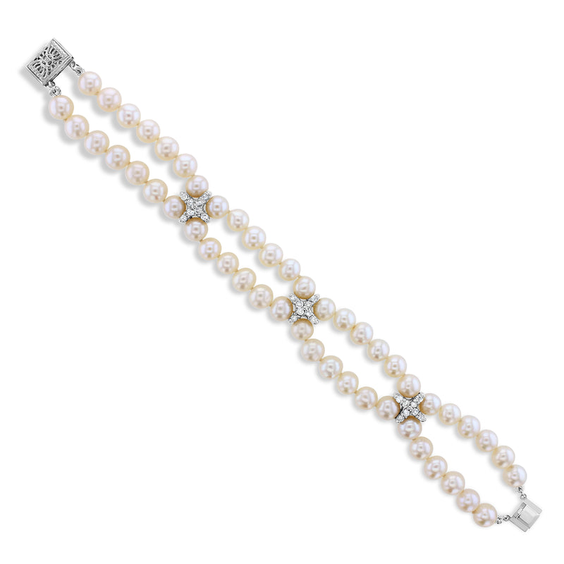 Bracelet de tennis en perles et diamants 0,72 ct en or blanc 14 carats