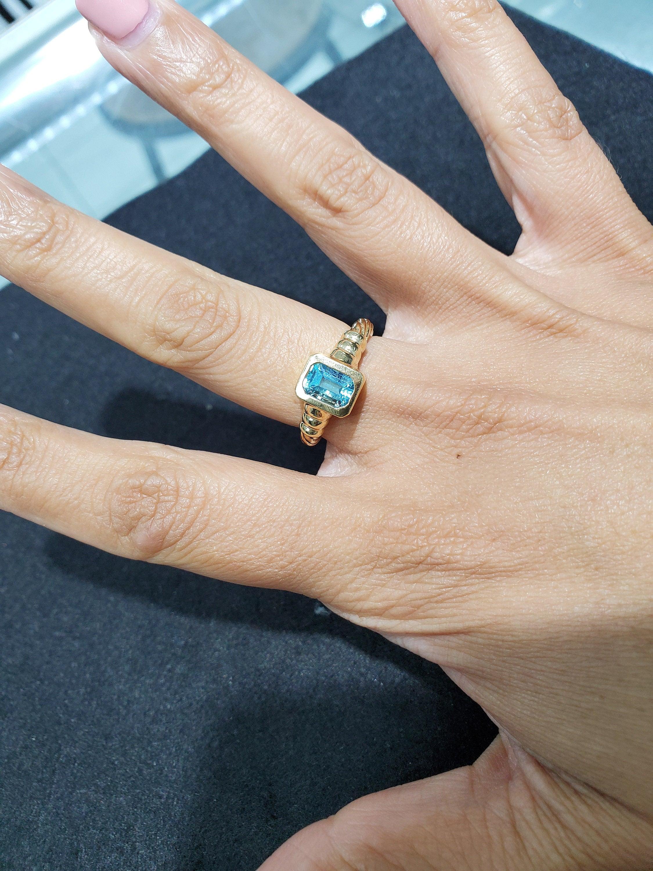 Solitaire Emerald Cut Blue Topaz Ring with Rope Band