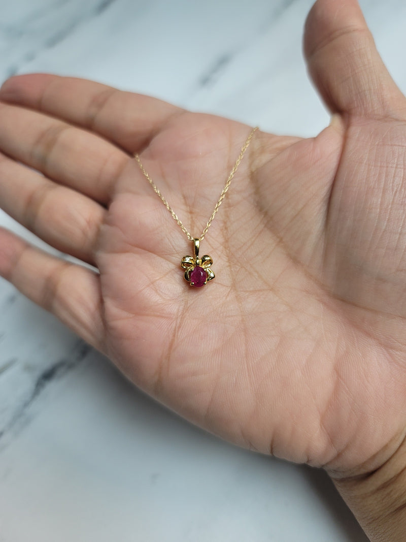 Oval Ruby Within A Ribbon Necklace 14k Yellow Gold
