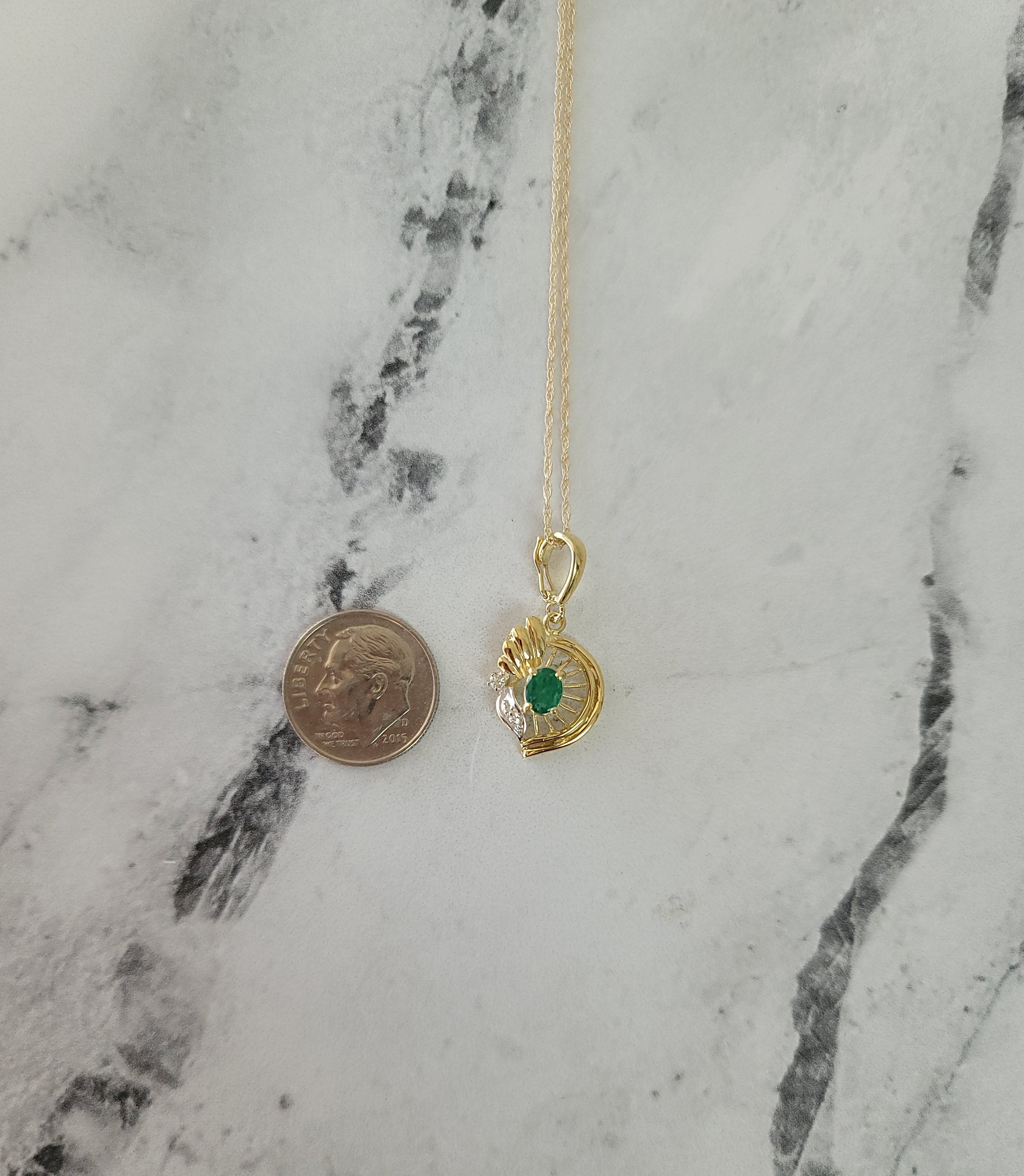 Oval Emerald in Seashell Design Necklace