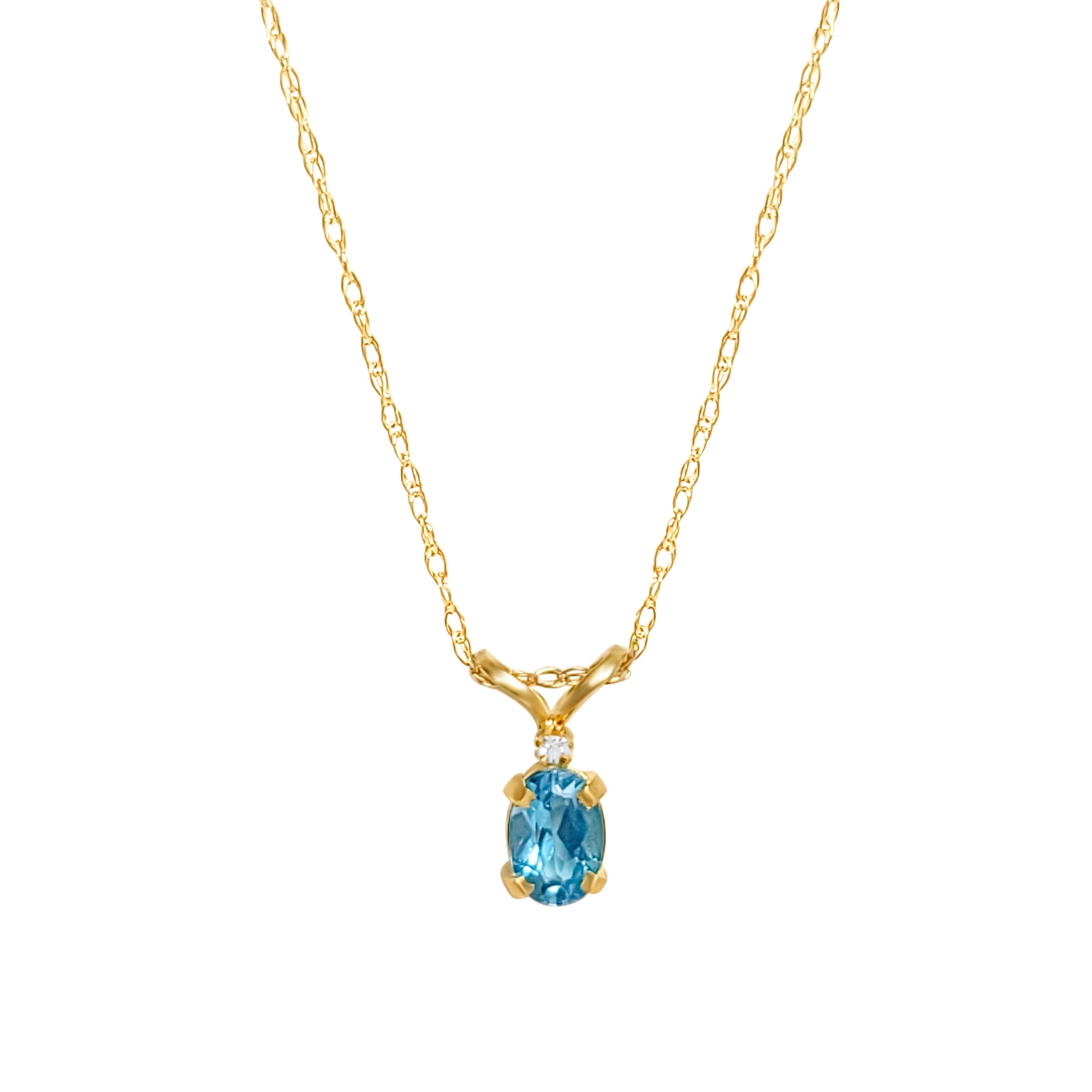 Solitaire Oval Blue Topaz with one small diamond .25cttw 14k Yellow Gold