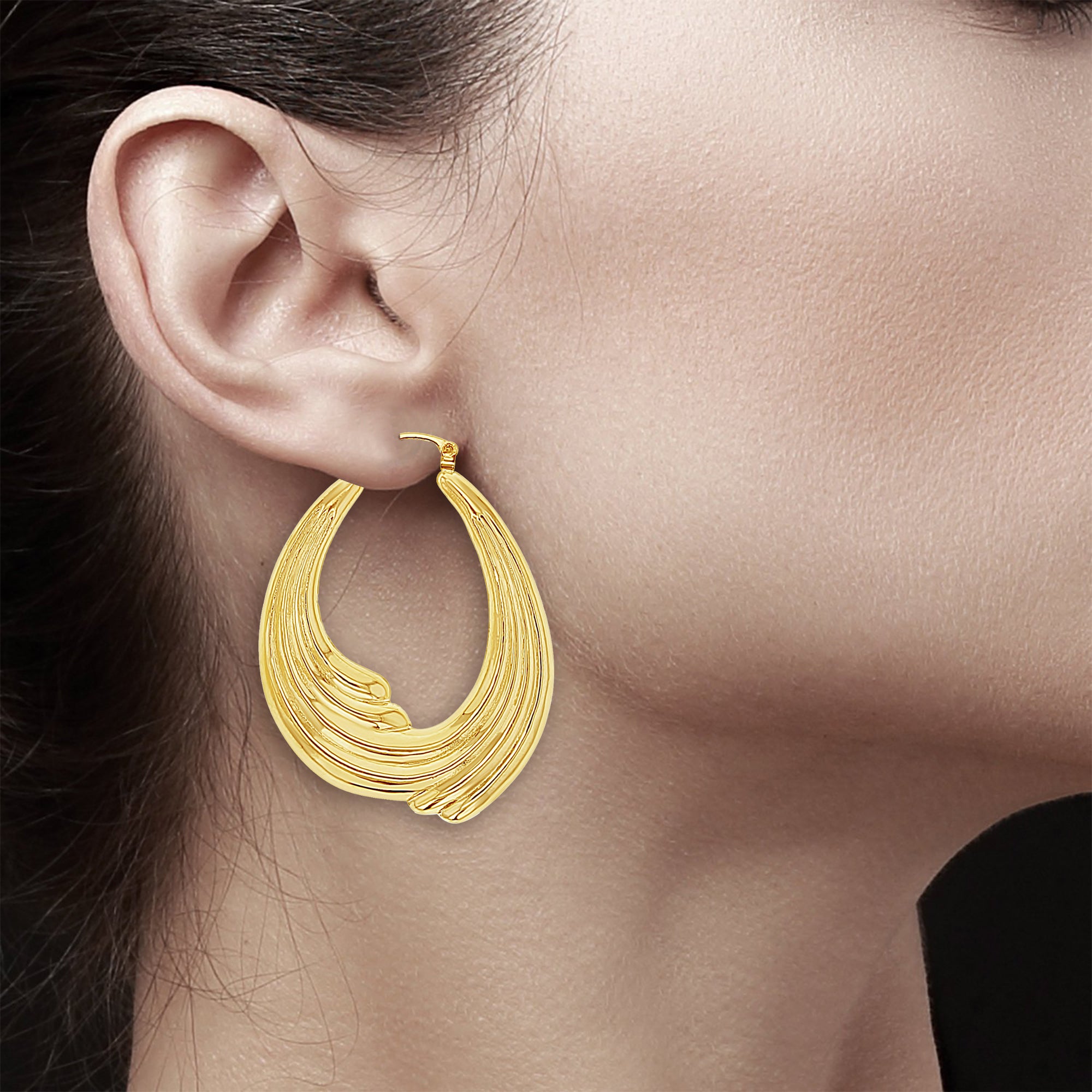 Aros estilo ola pulidos oro amarillo de 14k