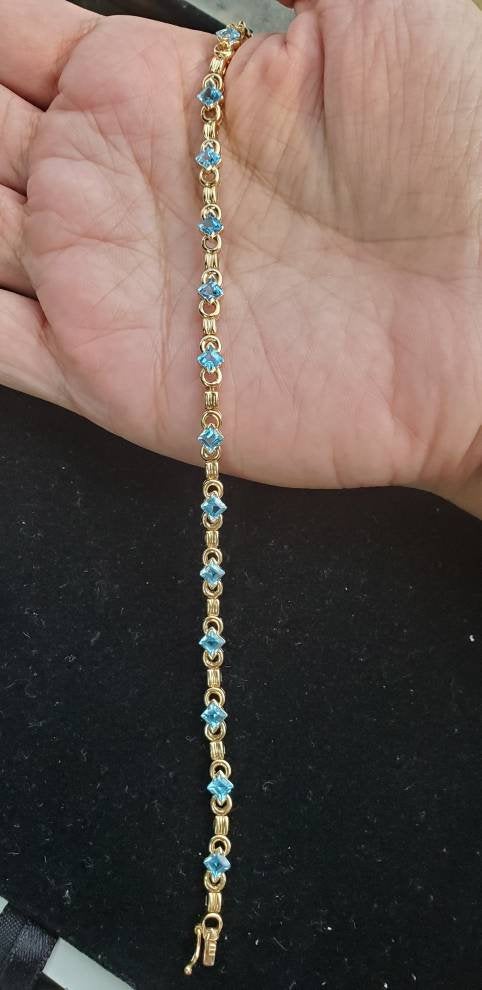 Blue Topaz Tennis Bracelet 1.50cttw 14k Yellow Gold