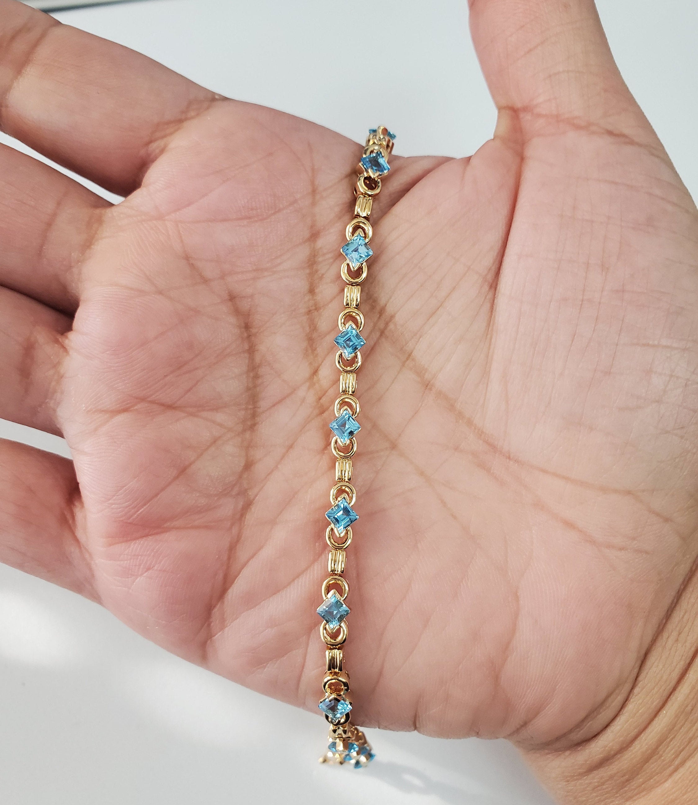 Blue Topaz Tennis Bracelet 1.50cttw 14k Yellow Gold